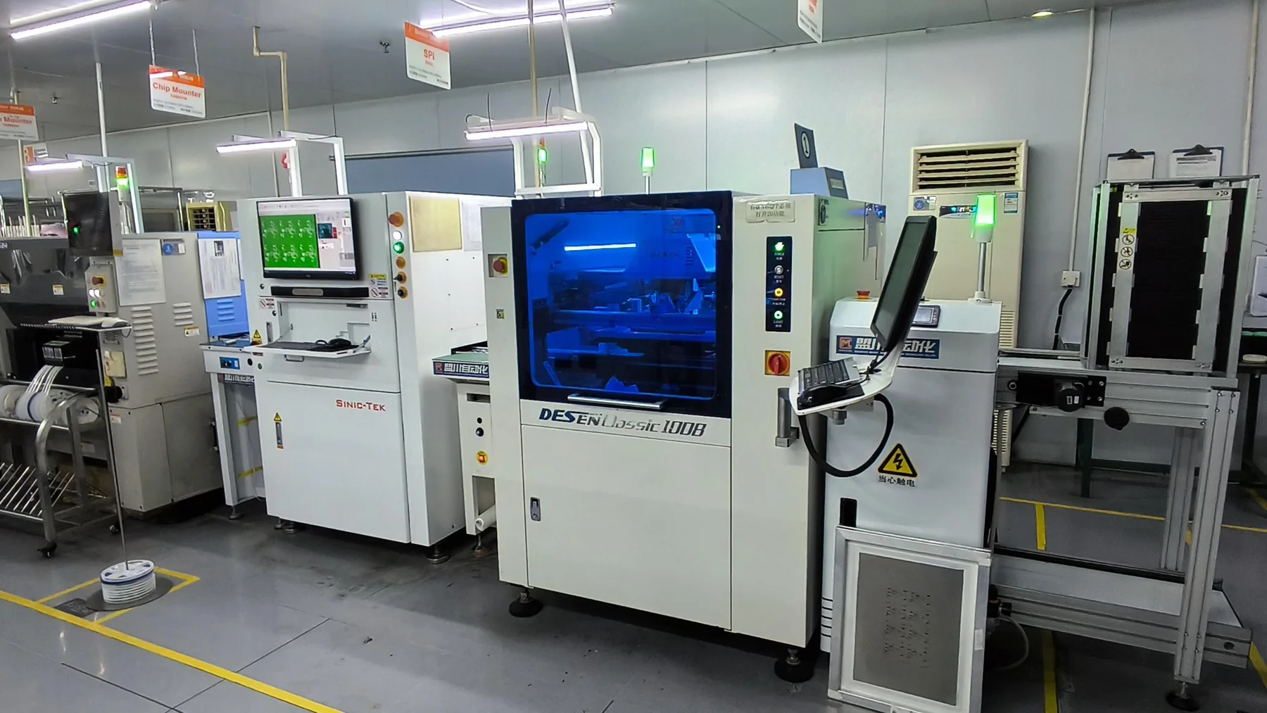 Automated production and inspection equipment visible in the Factory B source material